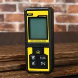 Лазерный дальномер Deli DL331040B  Диапазон измерения 0,05~50м, точность измерения ±3мм